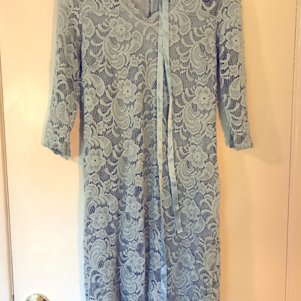 Powder blue lace bodycon maternity dress with satin sash.